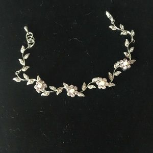 Silver bracelet w iridescent crystal flowers